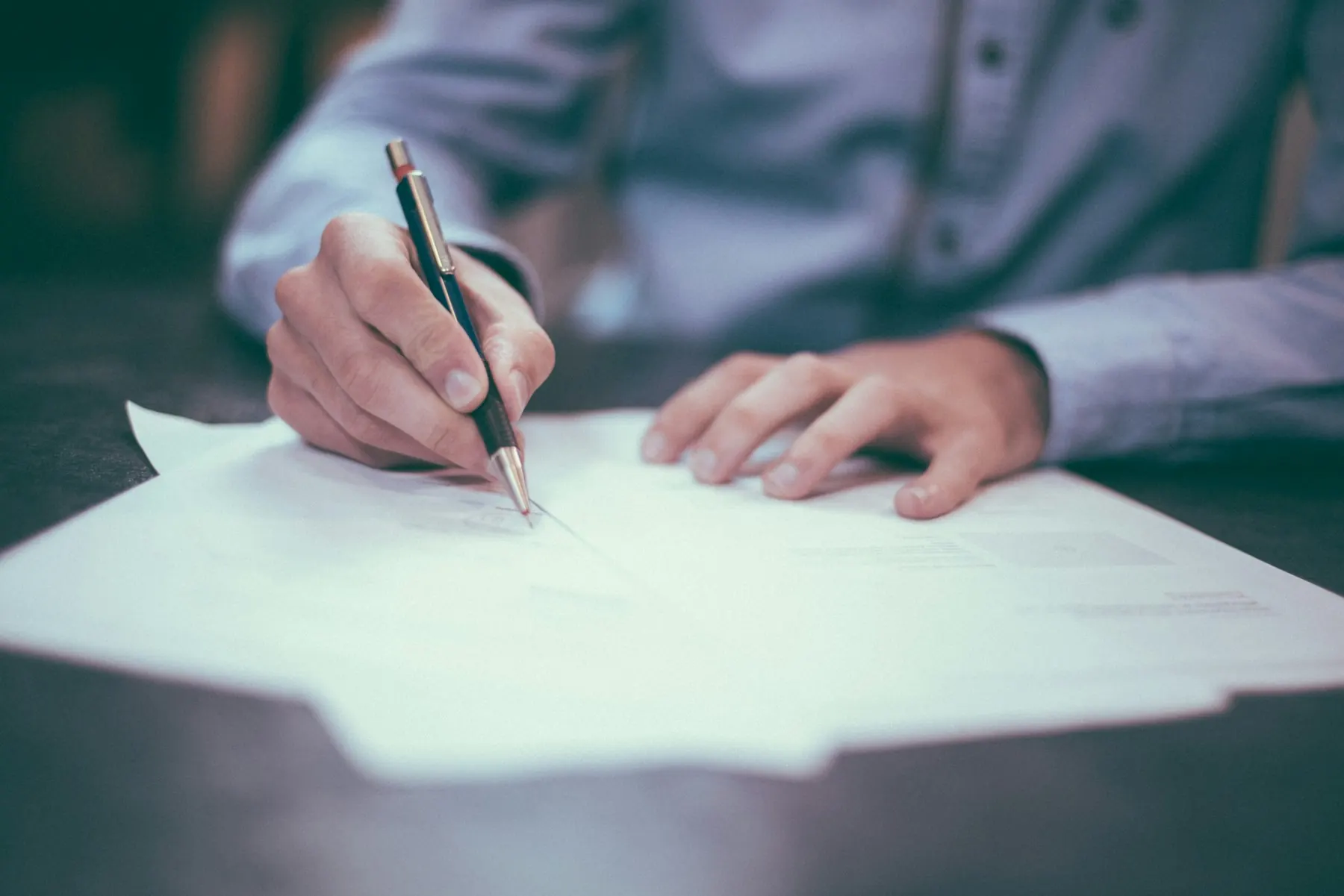 A document and pen on a desk