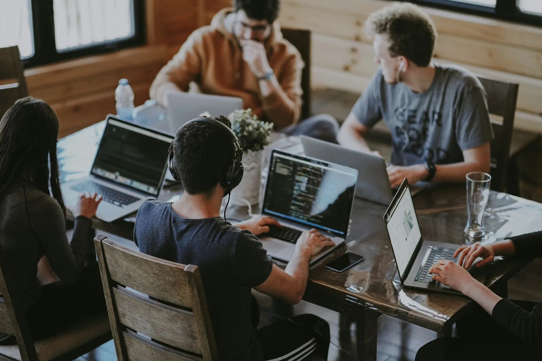 A product team working together around laptops in a studio